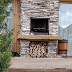Forged fireplace accessories + wooden basket with handmade forged accessories for the exterior